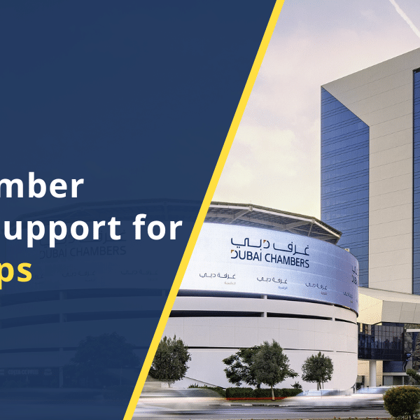 Professionals in a modern Dubai office discussing digital startup growth, reflecting Dubai Chamber's support.